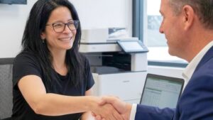 A registered tax agent explaining how to amend a tax return in Australia during a client consultation.